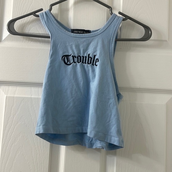 Blue cropped halter tank reads “trouble” - Picture 1 of 2